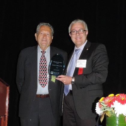 Dr. Joseph R. Bertino receives the Distinguished Investigator Award from Dr. Meibohm