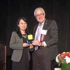  Dr. Peiying Zuo receives the  McKeen Cattell Memorial Award from Dr. Meibohm